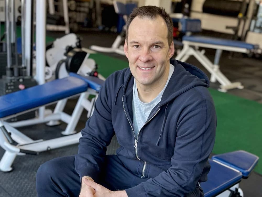 Dan Geraci seated in the gym